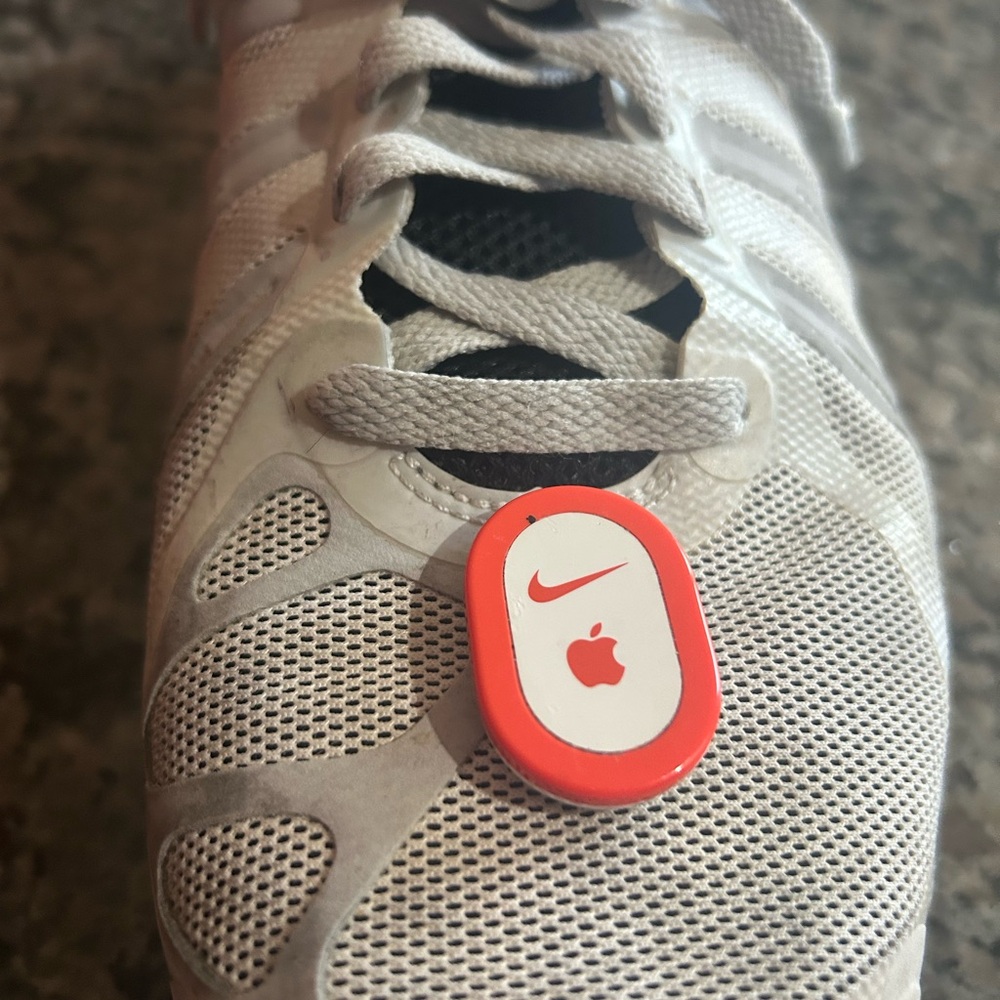 Nike White Athletic Shoe with Apple Sensor
